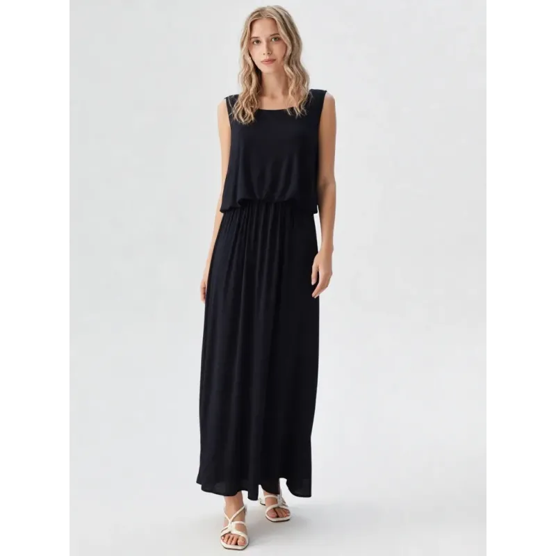 Black long flowy dress with layered top and soft drape for elegant daytime looks