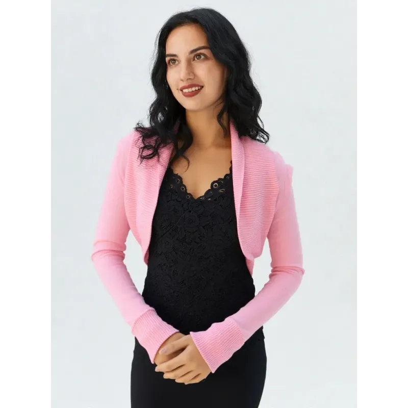 Pink long sleeve bolero in ribbed knit with shrug design, ideal for transitional outfits.