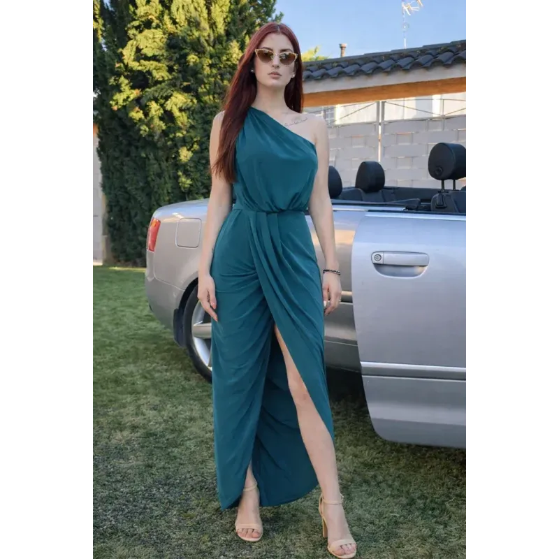 Emerald green draped dress with asymmetric design and elegant front slit for evening events