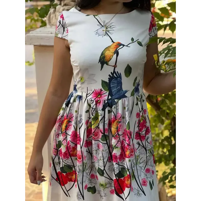 White short printed dress with boat neckline, fitted bodice and gathered skirt for women