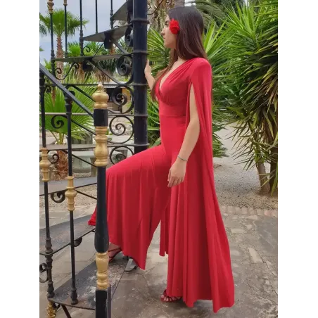 Red cape sleeve jumpsuit with plunging V-neck and flowing cape sleeves, elegant and perfect for parties or evening events