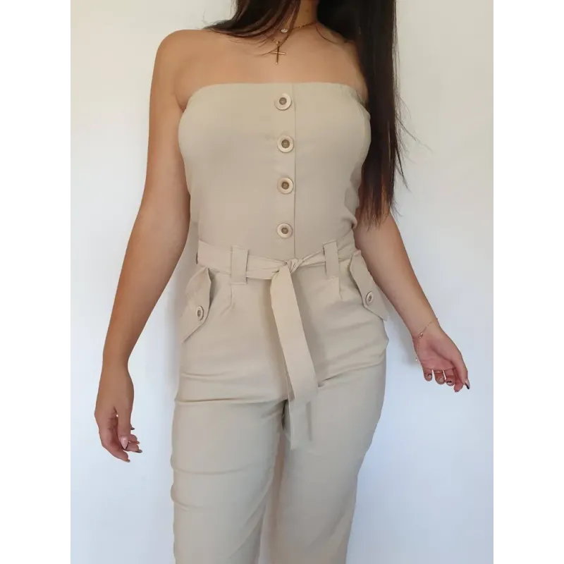 Beige strapless long jumpsuit with belt and straight leg.