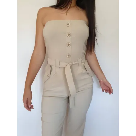 Beige strapless long jumpsuit with belt and straight leg.